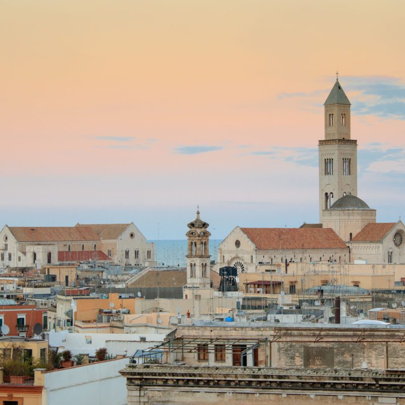 Cityscape of Bari at sunset with Basilica of San Nicola and Romanesque Cathedral